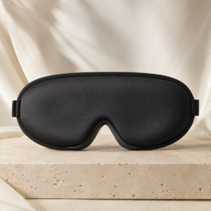 Classic Black RestWeave 3D Ice Silk Sleep Mask on a warm beige background