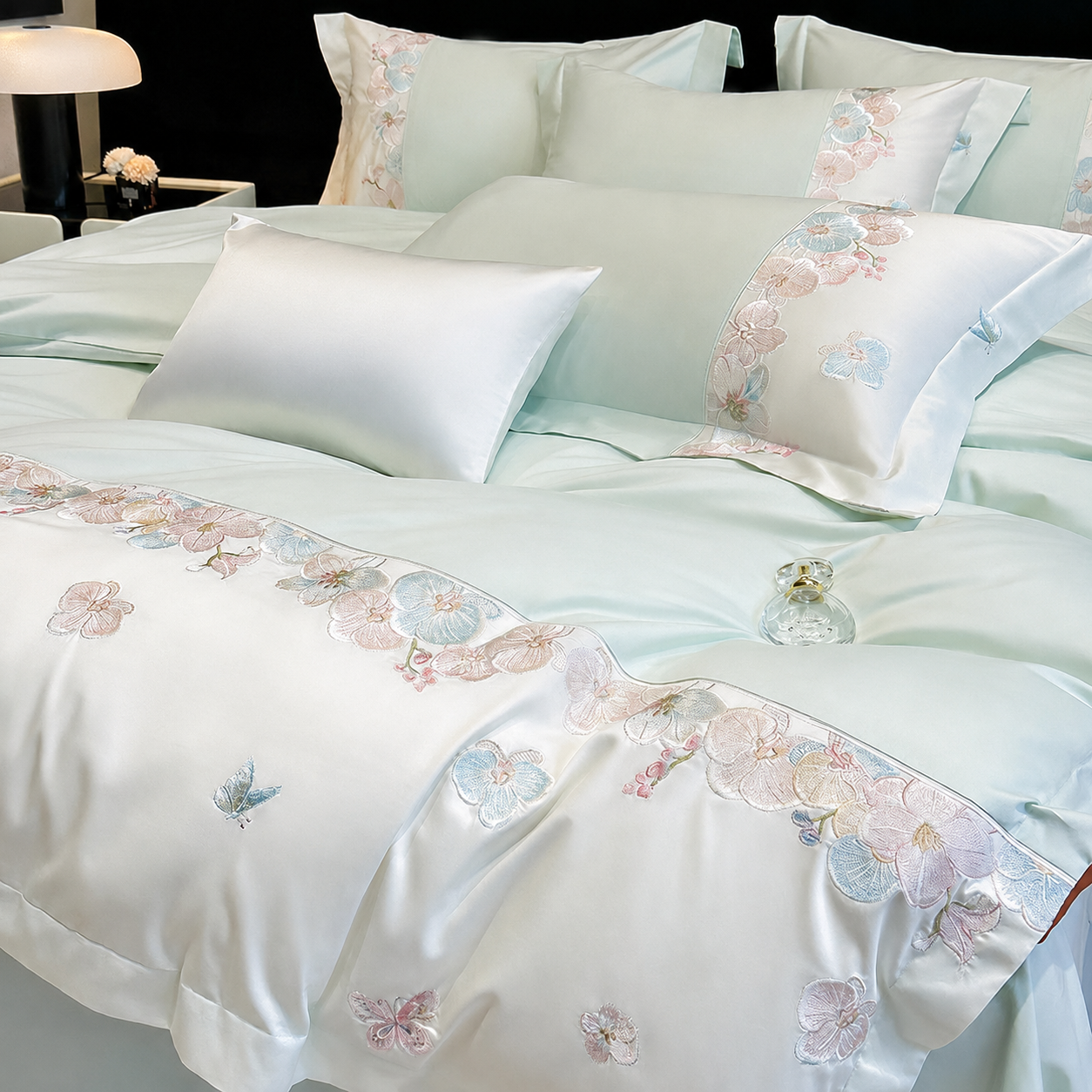 Soft Mint RestWeave duvet cover with ivory floral embroidery and butterfly details